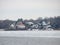 Winter Lake with Houses Water and Snow