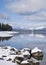 Winter lake landscape with snow covered mountains