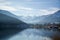 Winter lakeside scene with snow covered mountains