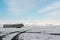 Winter landscape with airplane wreckage and snow capped mountains, Iceland