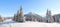 Winter landscape. Amazing panorama is opened on mountains, meadow, the forest with trees covered with snow and the blue sky.