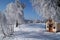 Winter landscape with blue sky and chapel with heart