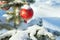 Winter landscape with Christmas fir tree decoration red ball and