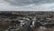 Winter landscape of the city and the river in the snow on a cloudy day. Winding river in the city park. Overcast weather.