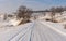 Winter landscape with country slippery road