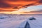 Winter landscape, cracked frozen lake ground covered of snow in sunset with beautiful sky at lake Baikal in Irkutsk, Russia