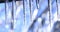 Winter landscape with crystal icicles and falling shiny drops. Video with icicle on beautiful bright background. Stalact