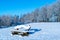 Winter landscape with deserted bench