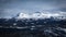 Winter landscape with dramatic snowy mountains