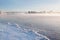 Winter landscape in the early morning overlooking the city of Dubna and the bridge over the Volga.