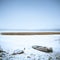 Winter Landscape. Frozen Boat on the Lake.