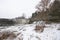 Winter landscape with frozen Jagala waterfall with icicles hanging from rocks, Estonia