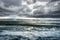 Winter Landscape frozen lake with ice floes and cloudy sky in Ic