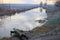 Winter landscape. Green grass along the river, covered with hoarfrost, winter frosts