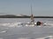 Winter landscape on icy lake.