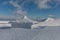 Winter landscape of Krkonose Mountains with Snezka Hill. Beautiful winter landscape Krkonos on a sunny day.