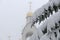 Winter landscape. Large spruces and an Orthodox church. Snowy winter and Christmas holidays.