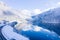 Winter landscape with misty foggy mountain and scenic crystal mountain lake