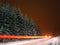 Winter landscape with motion blurred backlights
