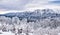 Winter landscape with mountain peaks covered in snow. Beautiful view with Bucegi Mountains part of the Carpathian Mountains, in