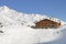 Winter landscape with mountain refuge