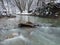 Winter landscape, mountain stream in the woods, snow idyll, snow-covered shores