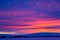 Winter landscape with mountains during amazing vivid saturated beautiful sunset sky in pink, purple and blue colors. Sunset