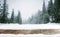 Winter landscape of mountains and wooden old table with snow