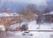 Winter landscape. old two-story apartment buildings of brick, with a chimney, with white snowy roofs. Around a lot of snow on the