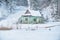 Winter landscape. Old wooden abandoned house