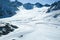 Winter landscape - Panorama of the ski resort with ski slopes. Alps. Austria. Pitztaler Gletscher. Wildspitzbahn