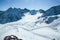 Winter landscape - Panorama of the ski resort with ski slopes. Alps. Austria. Pitztaler Gletscher. Wildspitzbahn