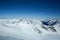 Winter landscape - Panorama of the ski resort with ski slopes. Alps. Austria. Pitztaler Gletscher. Wildspitzbahn