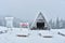 Winter landscape in the Polish mountains of the Sudetes, snow-covered tourist shelter on a mountain hiking trail, thick snow cover