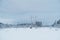 Winter landscape power lines in a snowy field in the forest