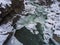 Winter landscape. River flowing in granite canyon.