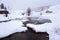 Winter landscape with ruined dam