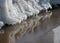 Winter landscape by the sea, snowy, interesting ice shapes on the sea shore, dunes covered with a white layer of shining snow