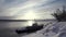 Winter landscape with a ship. Art. A winter river on which a ship is parked and snow in a circle with people walking.