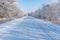 Winter landscape with slippery country road