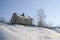 Winter landscape a small farmhouse on the Hill