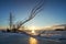 Winter landscape with snag on the frozen lake