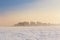 Winter landscape with snow covered frozen ice and city