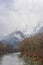 Winter landscape with snow covered Grimming mountain and Enns river in Ennstal, Steiermark, Austria