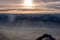 Winter landscape of snow covered mountains with fog in sunset. Rochers de Naye in Switzerland
