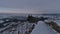 Winter landscape with snow-covered path, bare vineyards and panoramic view over village Wurmlingen, Germany.