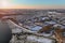 Winter landscape with after snowfall in the USA residential streets snow covered houses the American town near in river flowing