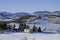 Winter landscape. Snowy hills, homes, nature, horizon. Natural background. Appennino-Tosco-emiliano