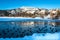 Winter Landscape with Snowy Mountain and Ducks in A Frozen Lake