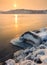 Winter landscape with snowy stones at the beautiful river